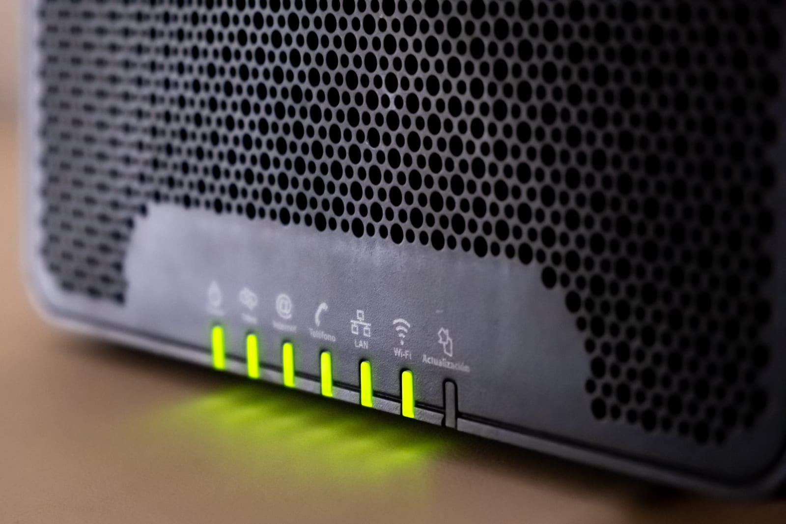 The status lights on an LTE router glowing in a dark room